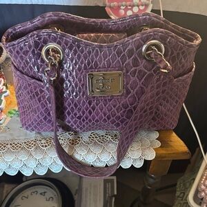 Nicole Miller Crocodile Purple Small Bag ..

Width  10
Length 7